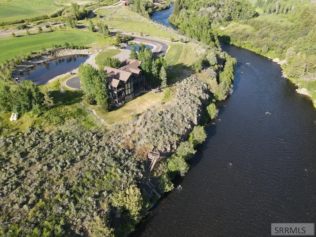 An East Idaho home and grounds beside the river, seen from above